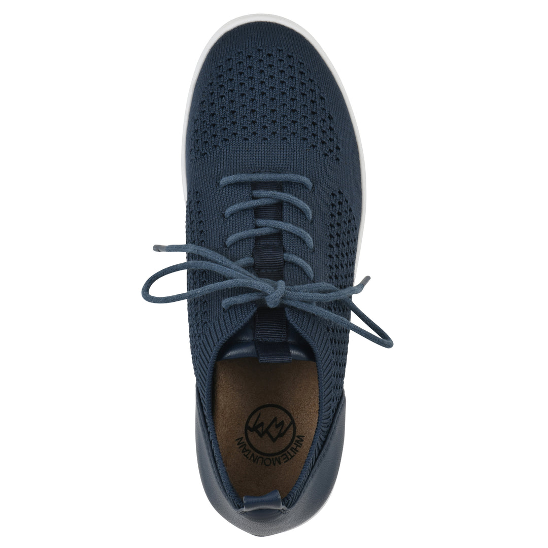 Top view of a navy sneaker with lace-up design and perforated mesh fabric