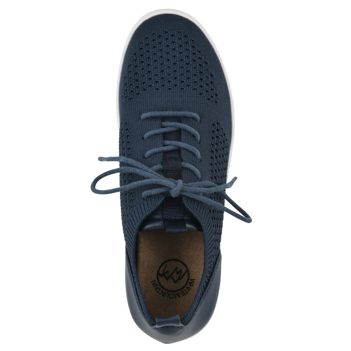 Top view of a navy sneaker with lace-up design and perforated mesh fabric