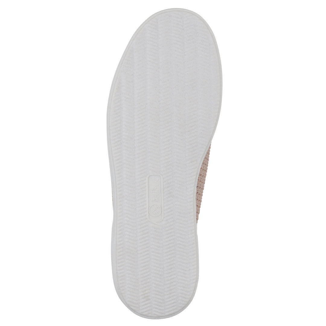 Sole view of a pink sneaker with white sole, lace-up design and perforated mesh fabric