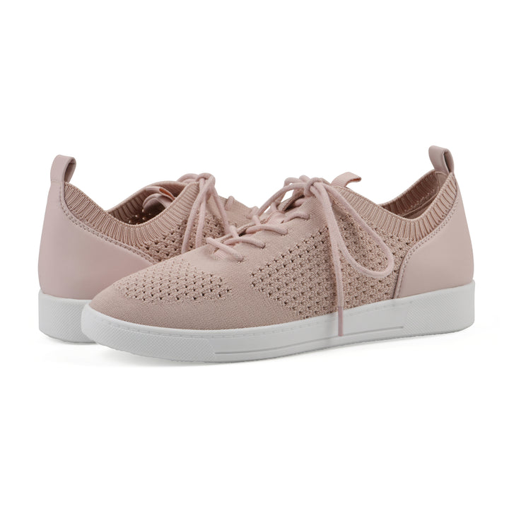 Angle view of a pair of pink sneaker with white sole, lace-up design and perforated mesh fabric