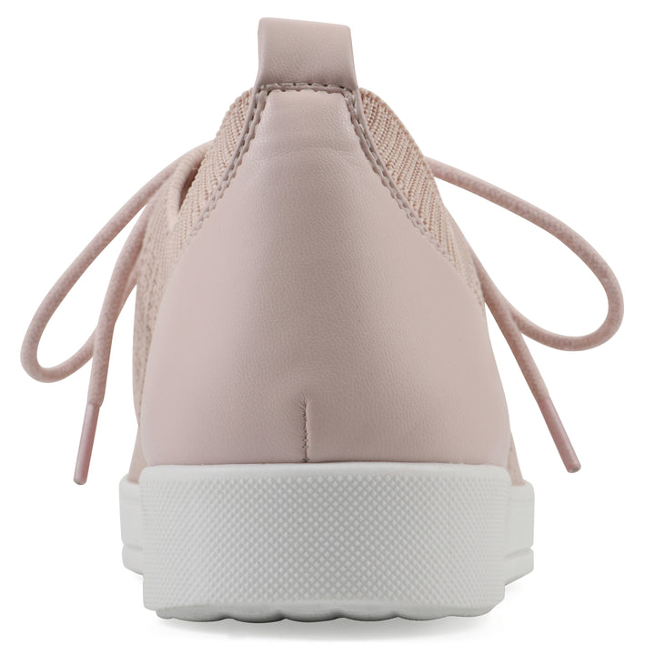 Rear view of a pink sneaker with white sole, lace-up design and perforated mesh fabric