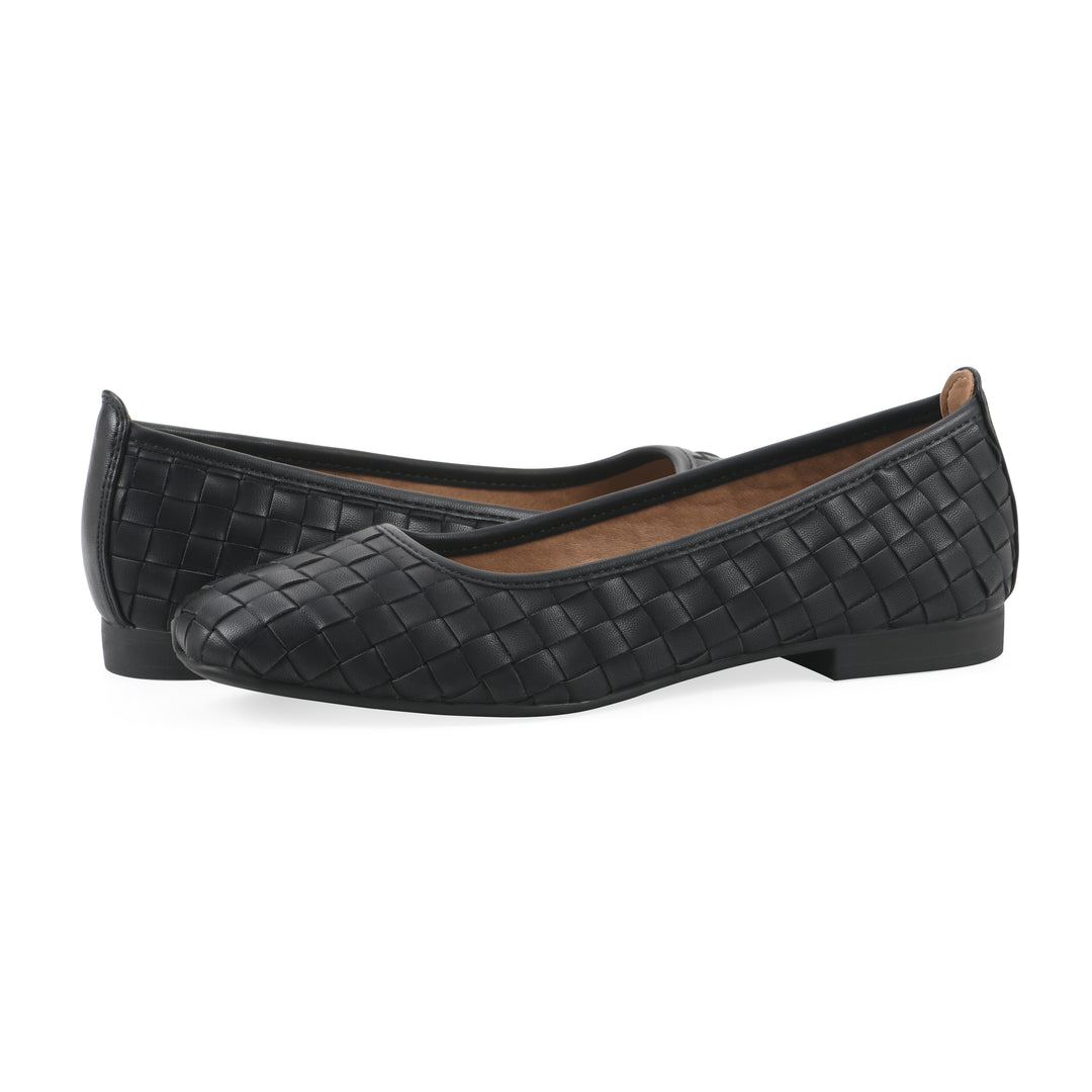 Angle view of a pair of black faux leather, woven pattern flats with a black sole