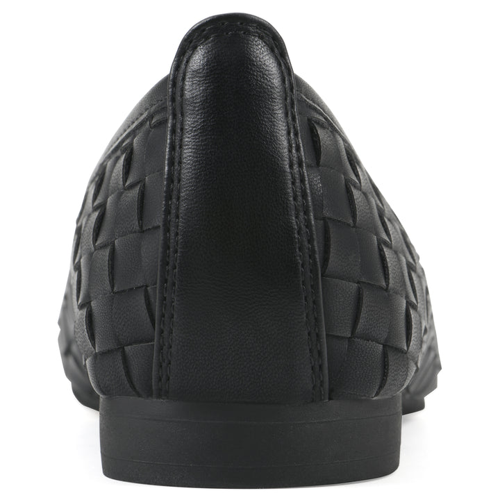 Rear view of a black faux leather, woven pattern flat with a black sole