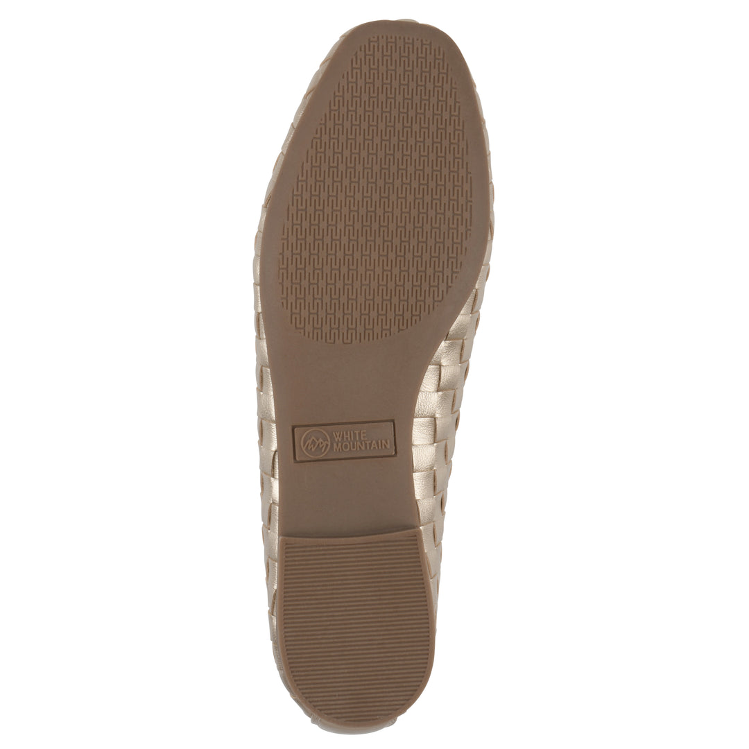 Sole view of a light gold faux leather, woven pattern flat with a brown sole