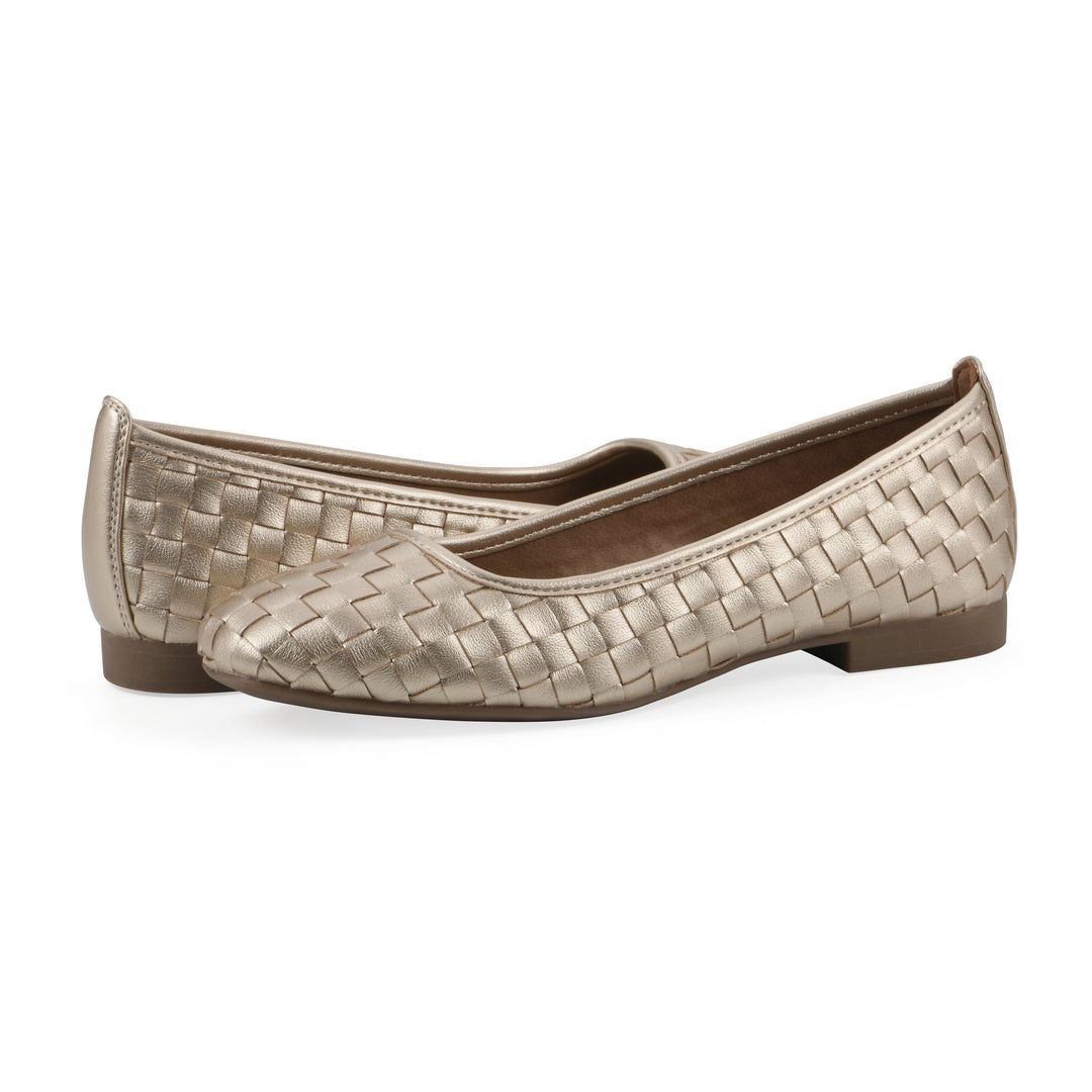 Angle view of a pair of light gold faux leather, woven pattern flats with a brown sole