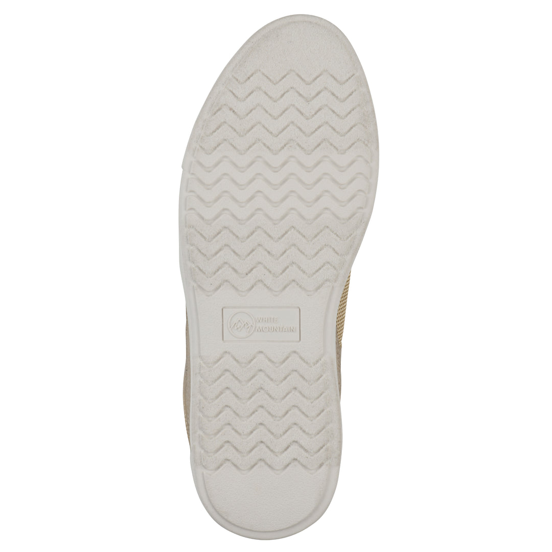 Sole view of a beige sneaker with white sole, zipper entry and faux laces detail