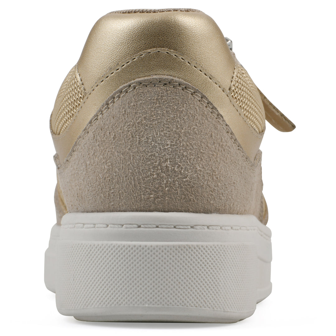 Heel view of a beige sneaker with white sole, zipper entry and faux laces detail