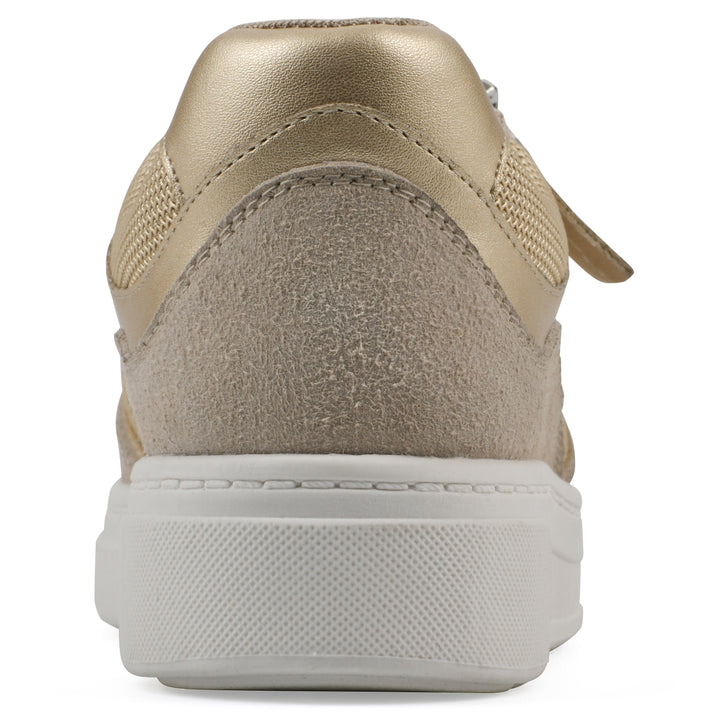 Heel view of a beige sneaker with white sole, zipper entry and faux laces detail