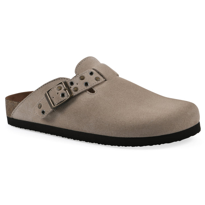 Angle view of a tan suede backless clog with an adjustable buckle strap with stud and eyelet detailing and a black sole