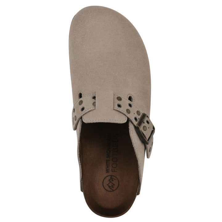 Top view of a tan suede backless clog with an adjustable buckle strap with stud and eyelet detailing and a black sole