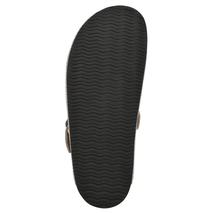 Sole view of a tan micro-sequined backless clog with adjustable buckle strap and black sole