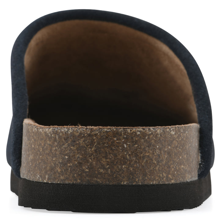 Rear view of a black and white multi felt and suede backless clog with a black sole