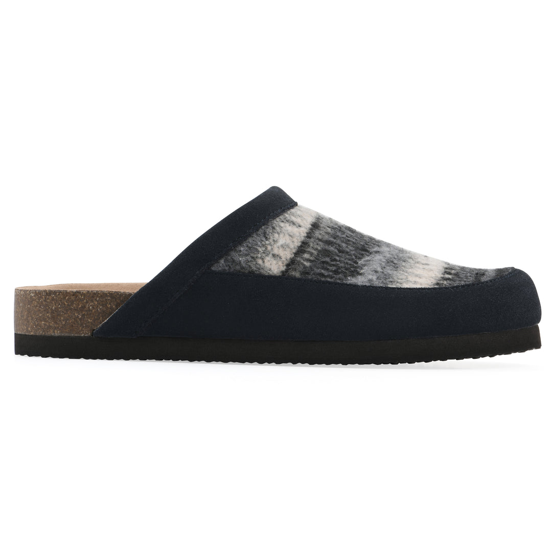 Side view of a black and white multi felt and suede backless clog with a black sole