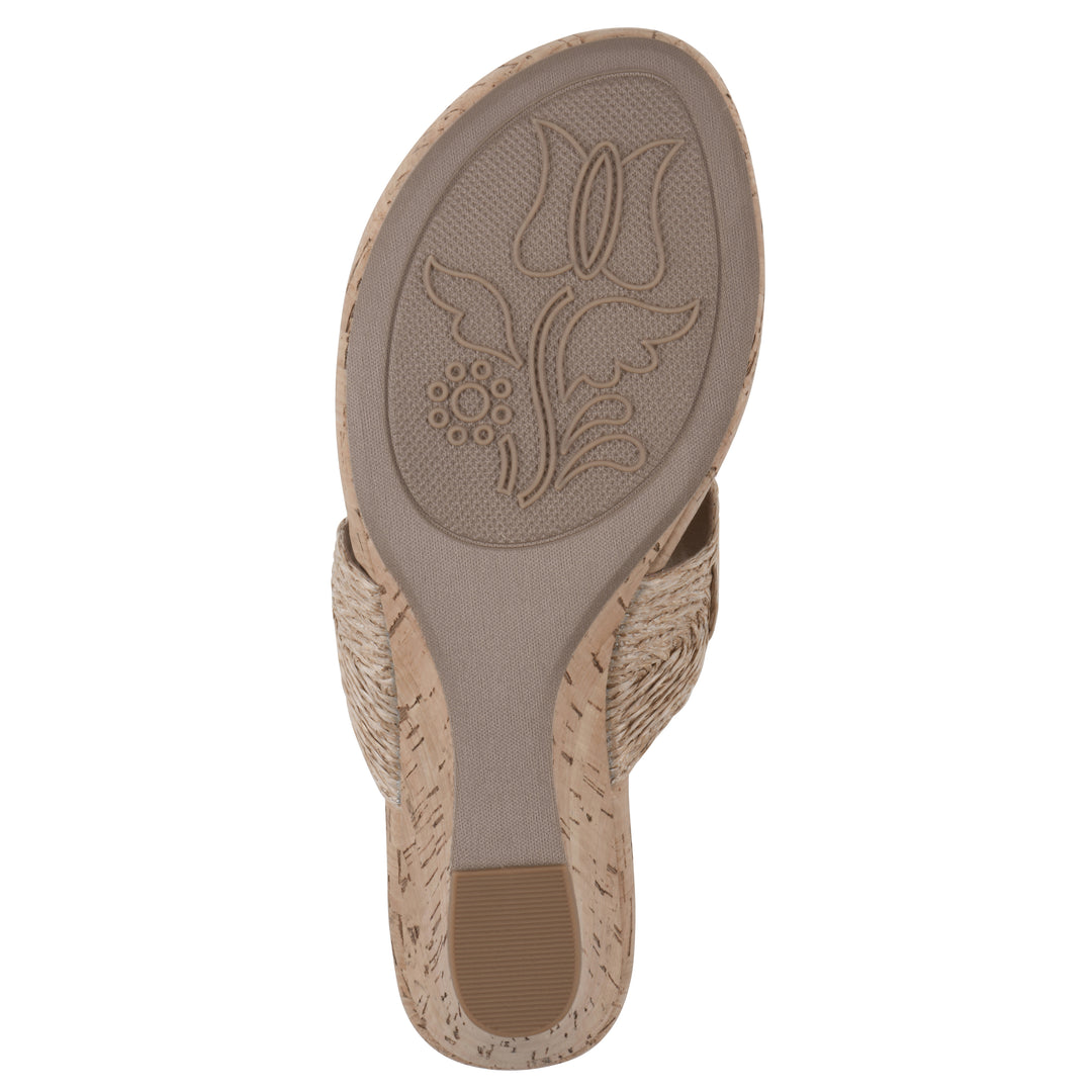 Sole view of a cork print wedge sandal with natural cream raffia thong design 