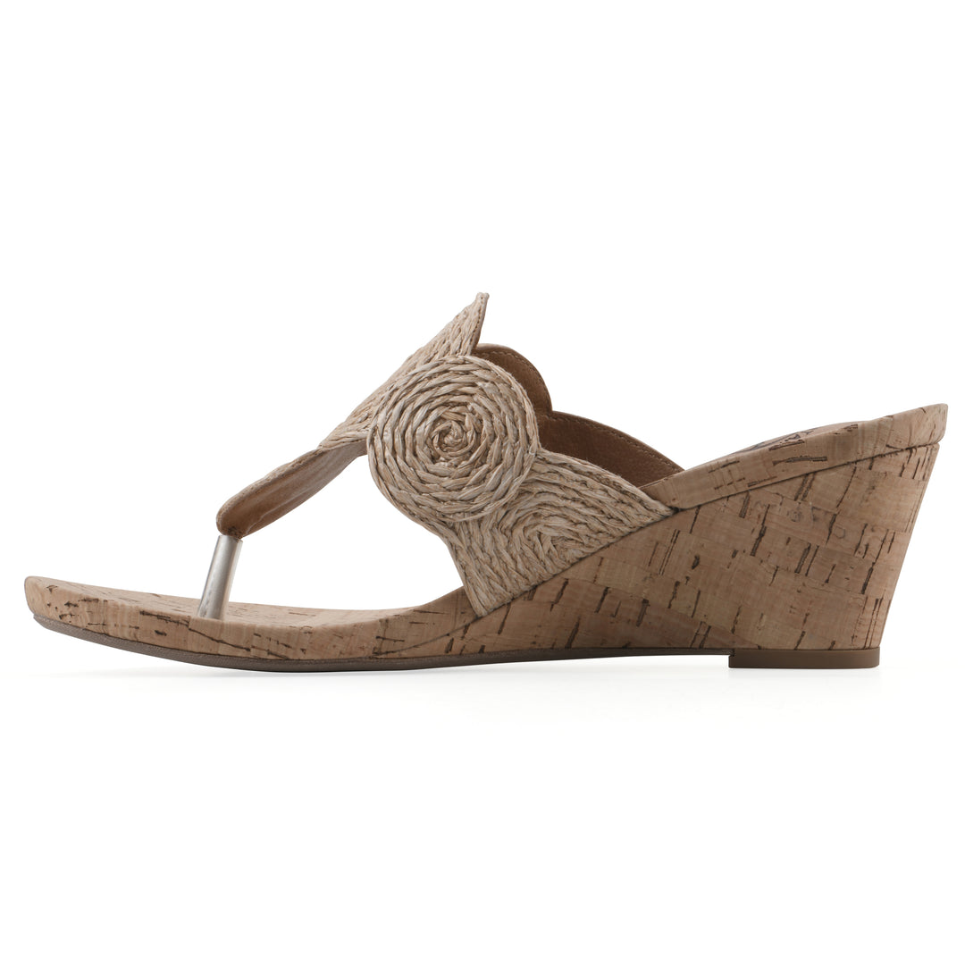 Side view of a cork print wedge sandal with natural cream raffia thong design 