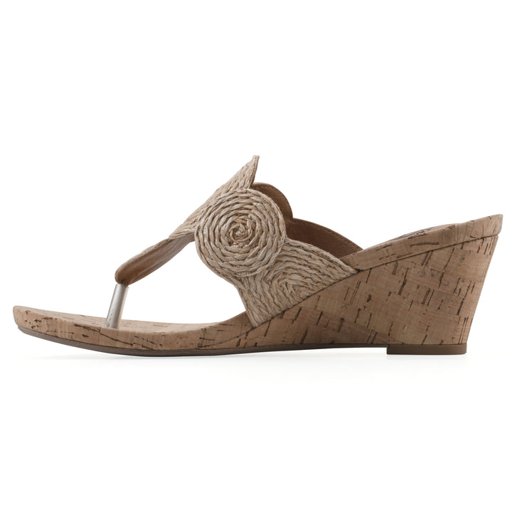 Side view of a cork print wedge sandal with natural cream raffia thong design 