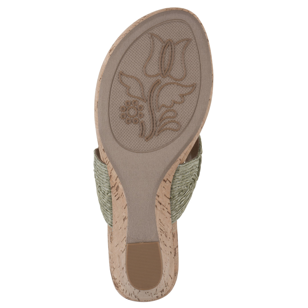 Sole view of a cork print wedge sandal with green raffia thong design 