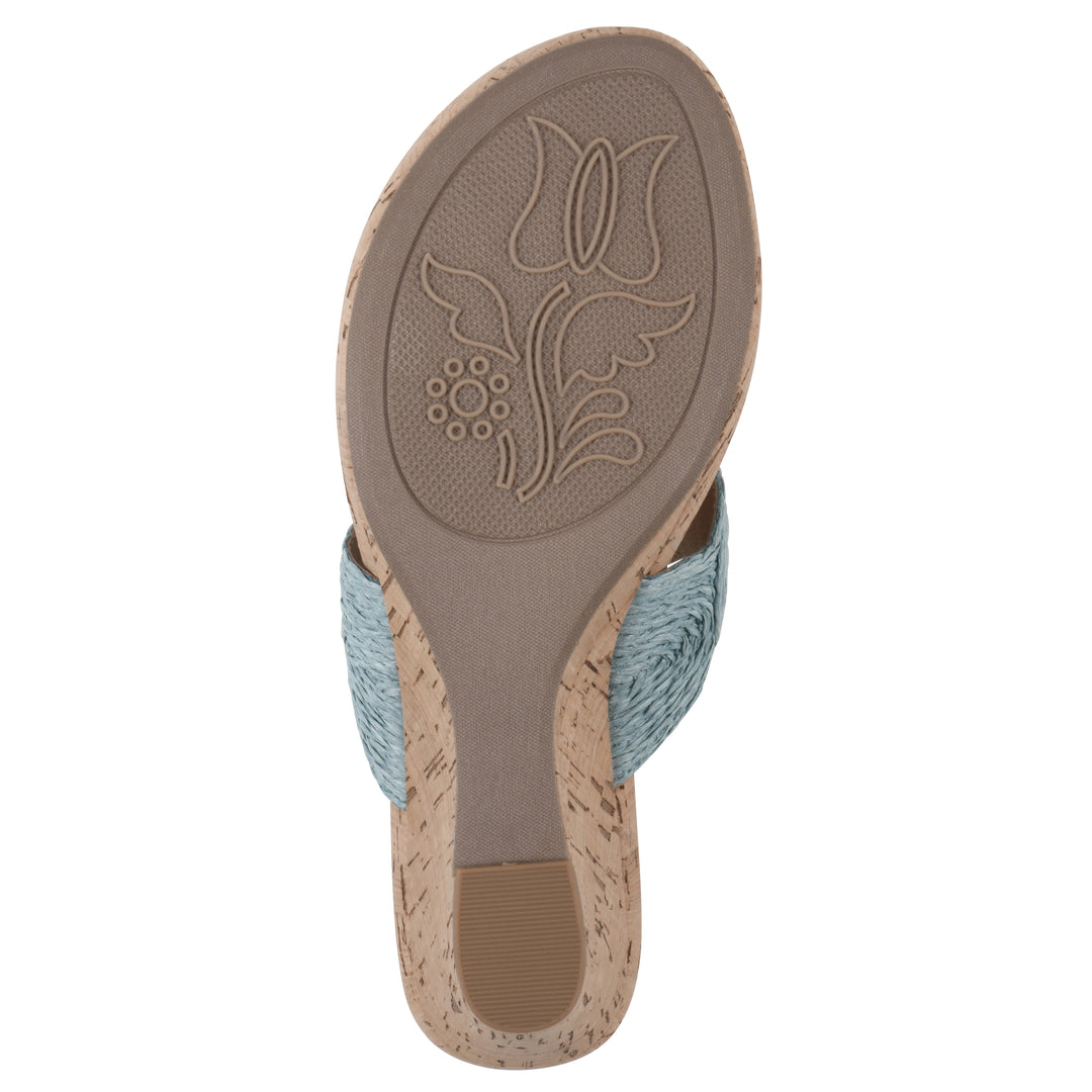 Sole view of a cork print wedge sandal with light blue raffia thong design 