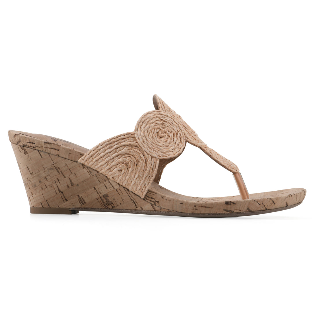 Side view of a cork print wedge sandal with natural apricot color raffia thong design 