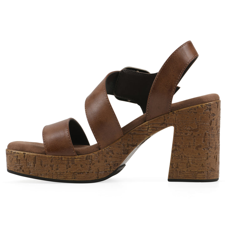Side view of a brown platform sandal with ankle buckle and a brown, faux cork sole
