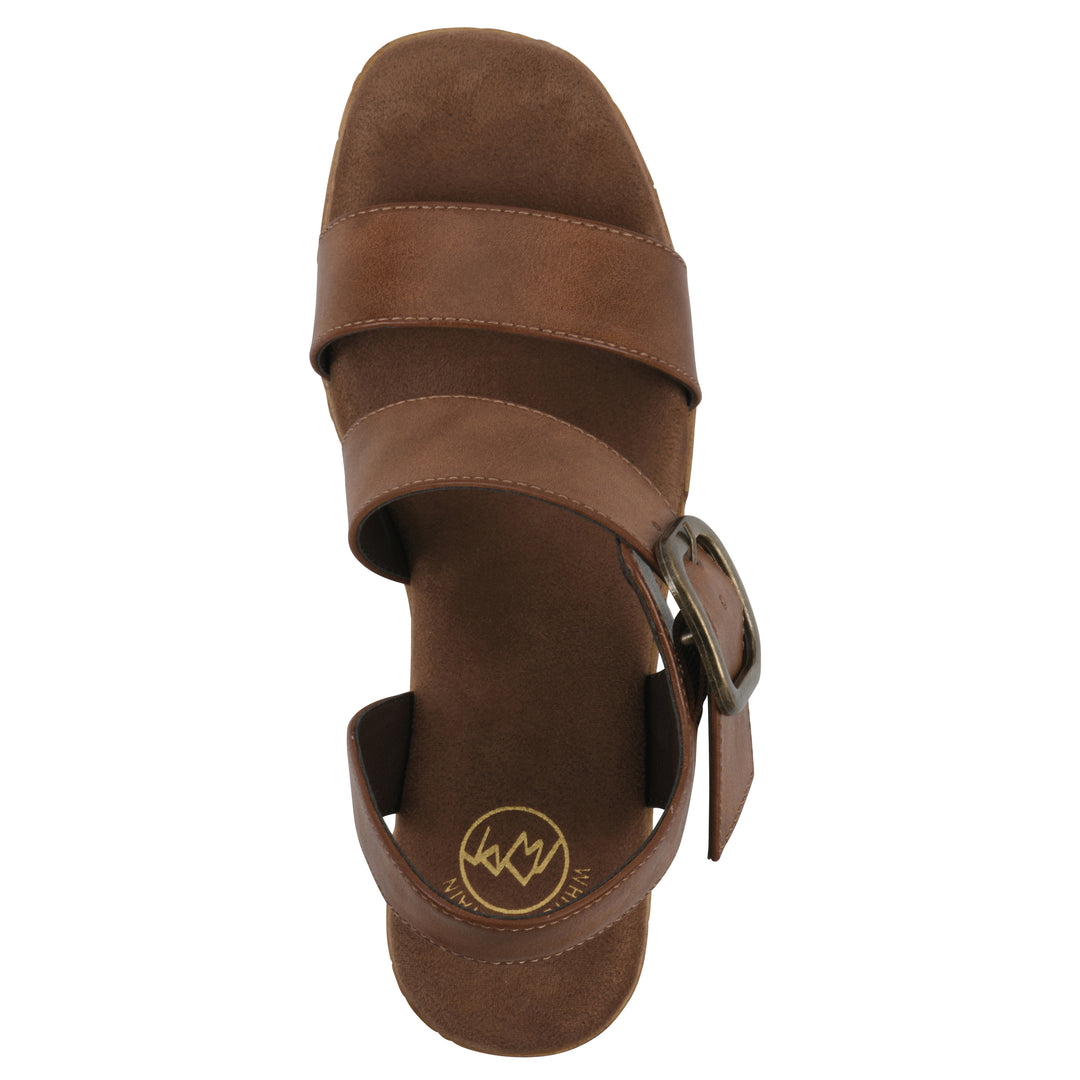 Top view of a brown platform sandal with ankle buckle and a brown, faux cork sole