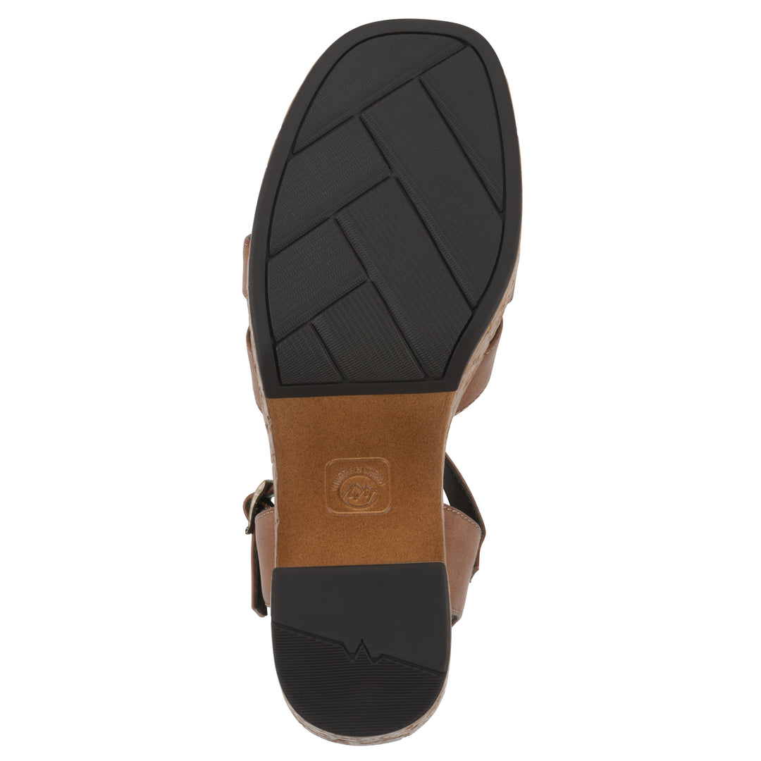 Sole view of a brown faux leather platform sandal with buckle style ankle strap and a brown molded cork bottom