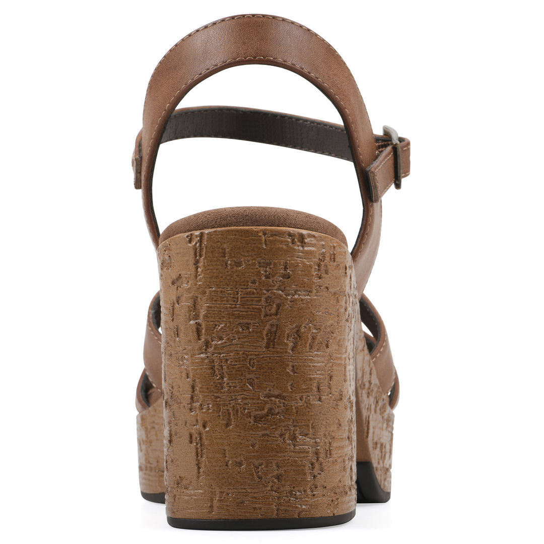 Rear view of a brown faux leather platform sandal with buckle style ankle strap and a brown molded cork sole