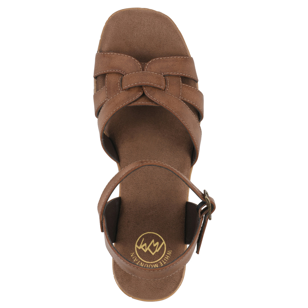 Top view of a brown faux leather platform sandal with buckle style ankle strap and a brown molded cork sole
