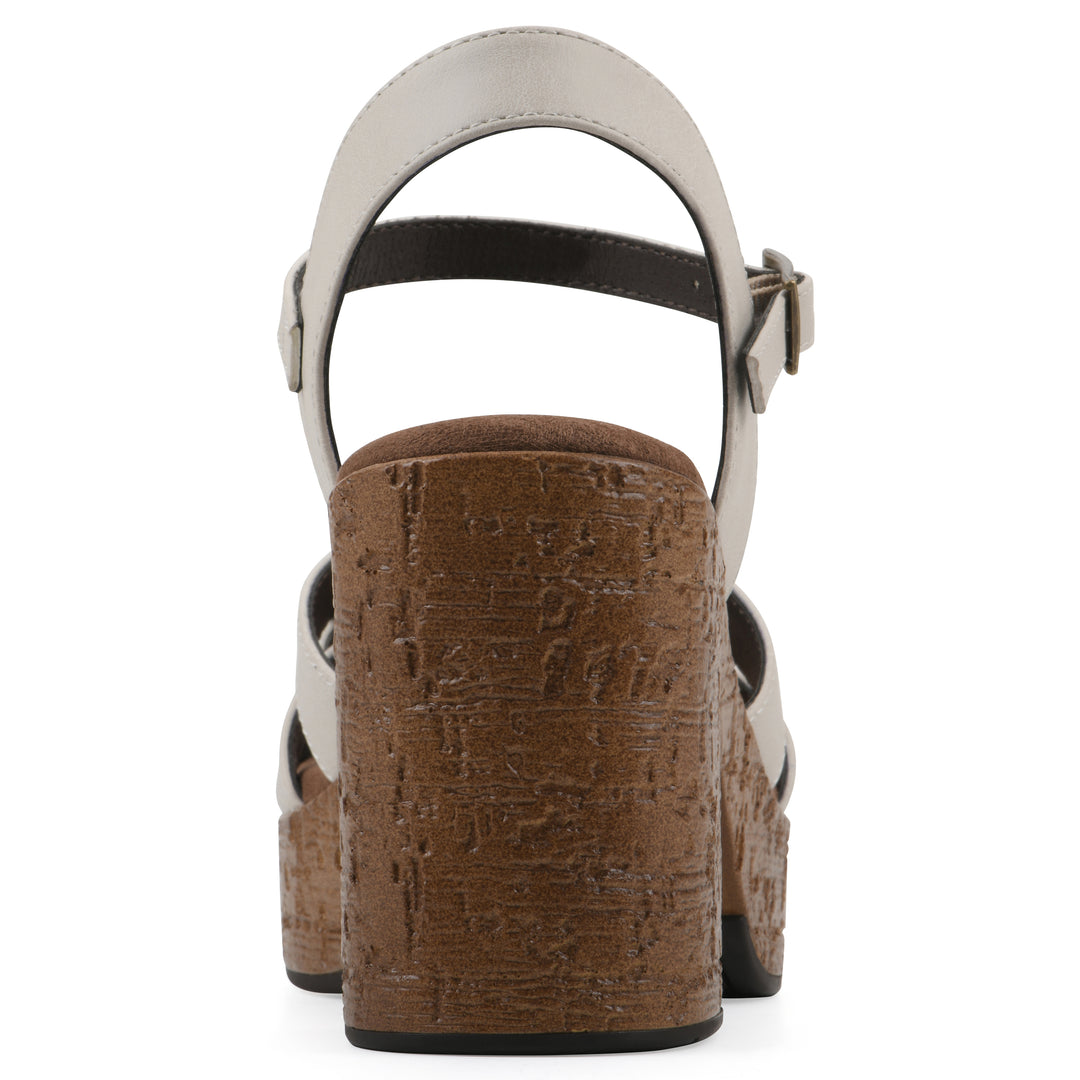 Rear view of a cream faux leather platform sandal with buckle style ankle strap and a brown molded cork sole