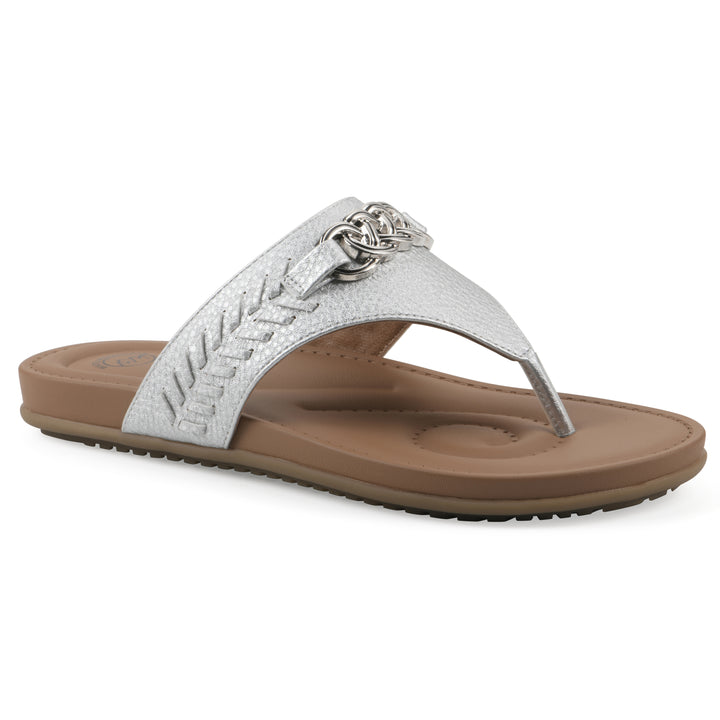 Angle view of a silver thong sandal with metal embellishment and a brown sole
