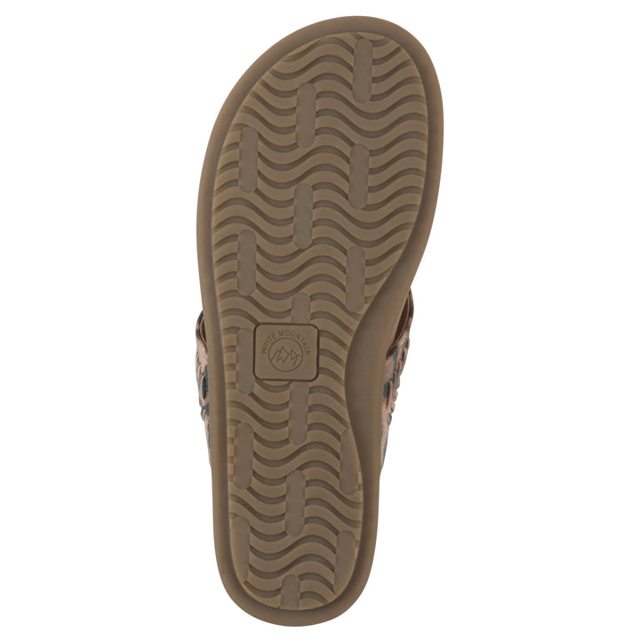 Rear view of a leopard print thong sandal with metal embellishment and a brown sole