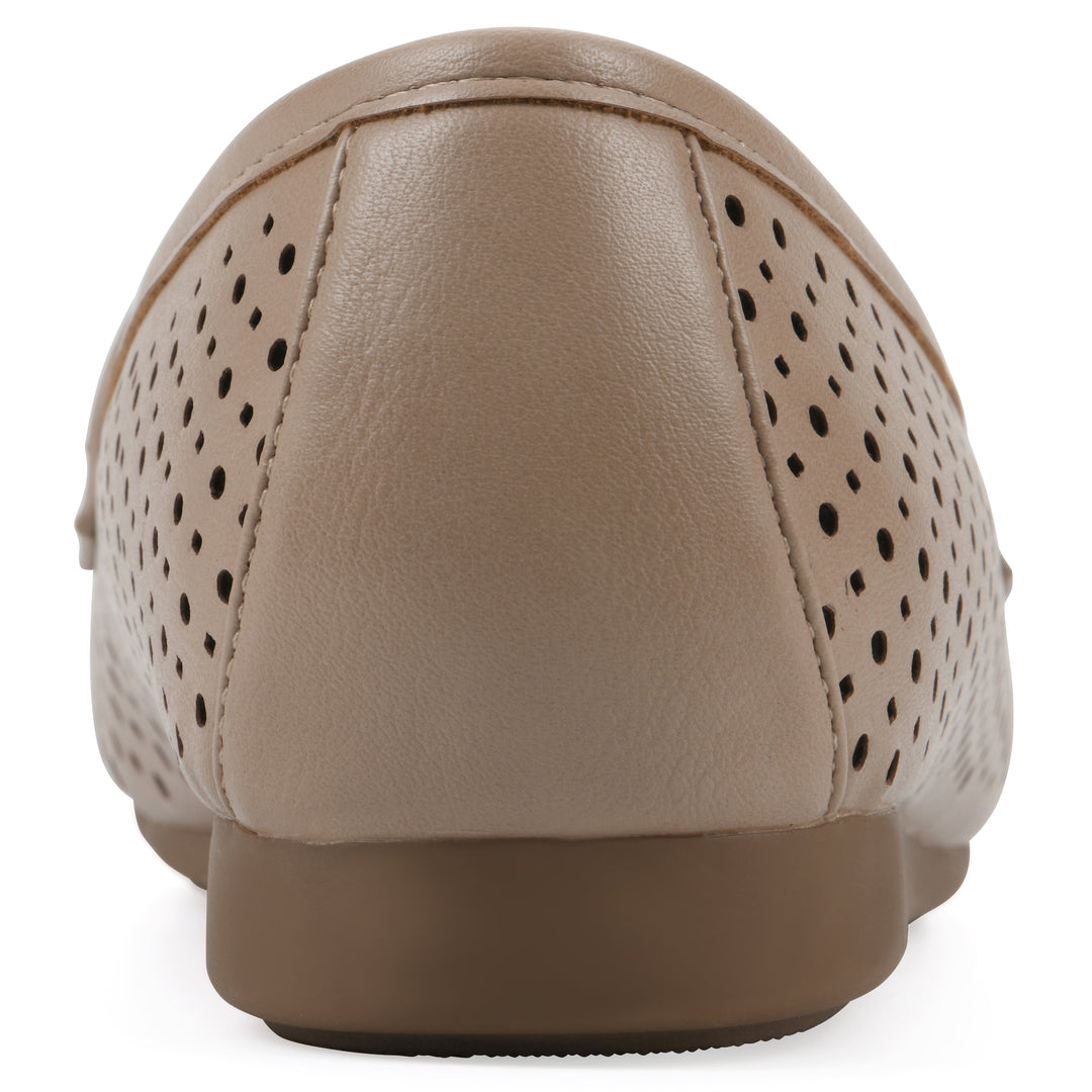 Rear view of a beige perforated loafer shoe 