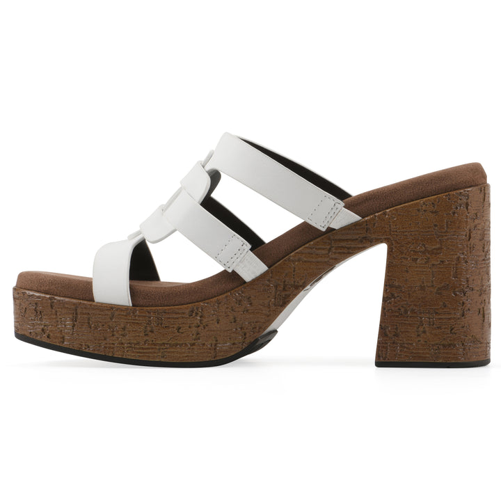 Side view of a white faux leather platform sandal, with multi-interlaced straps and a brown cork style sole