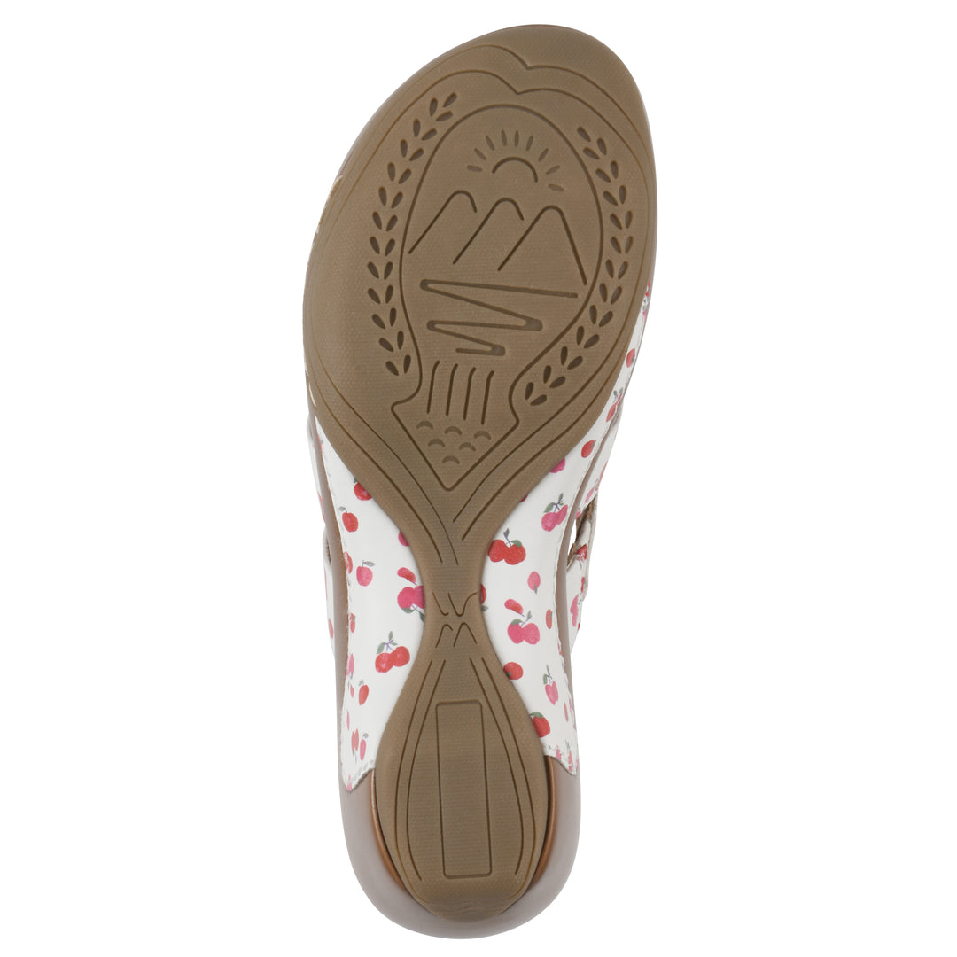 Sole view of an open-toe mule sandal in white with a red cherry pattern, a cushioned insole, and a brown heel 