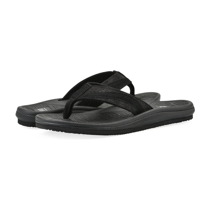 Angle view of a pair of cushioned black fabric thong sandals with black patterned sole