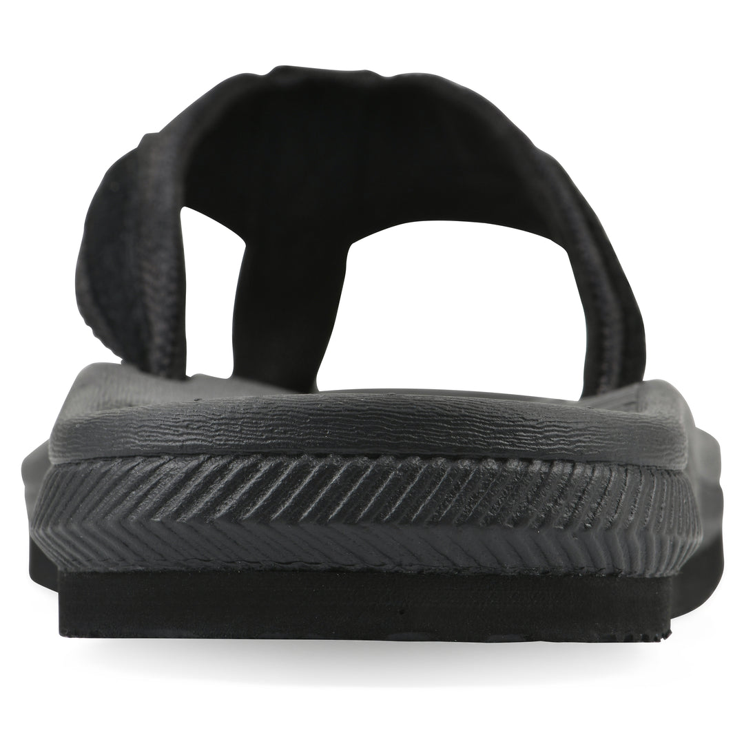 Rear view of a cushioned black fabric thong sandal with black patterned sole