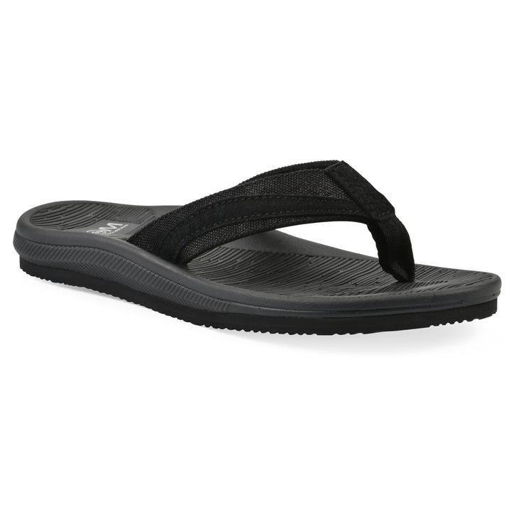 Angle view of a cushioned black fabric thong sandal with black patterned sole