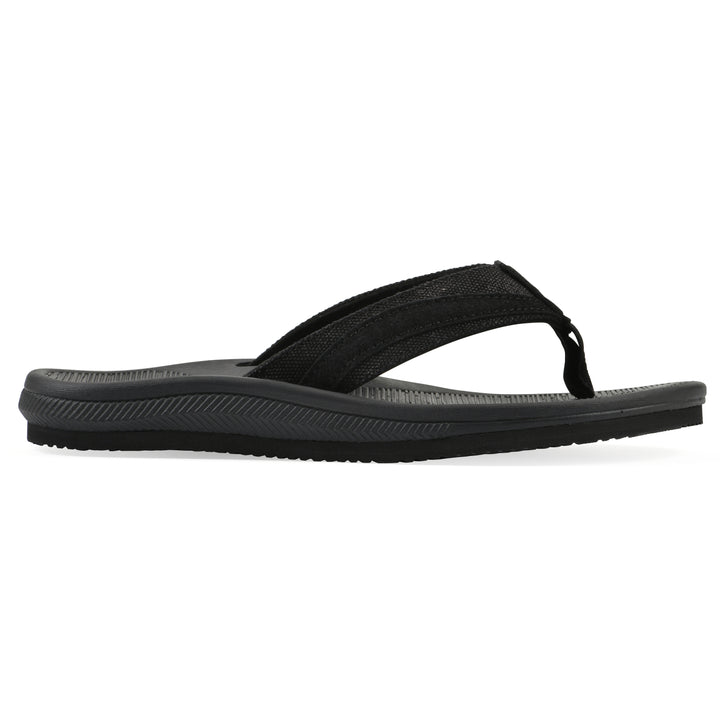 Side view of a cushioned black fabric thong sandal with black patterned sole