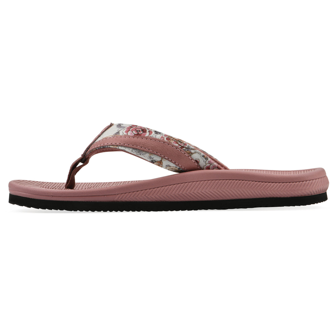 Side view of a cushioned pink floral thong sandal with pink patterned sole