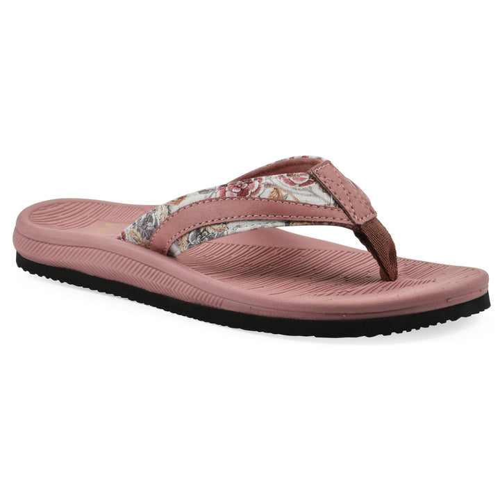 Angle view of a cushioned pink floral thong sandal with pink patterned sole