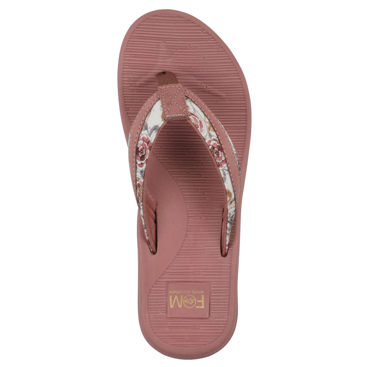 Top view of a cushioned pink floral thong sandal with pink patterned sole