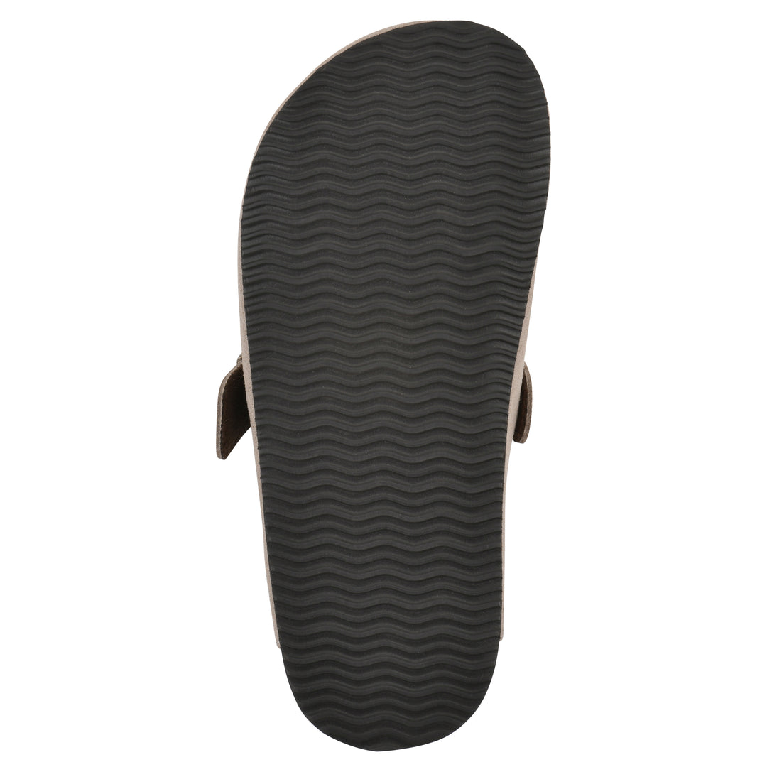 Sole view of a taupe suede children's clog with metal buckle on an adjustable strap, and a brown sole with black bottom
