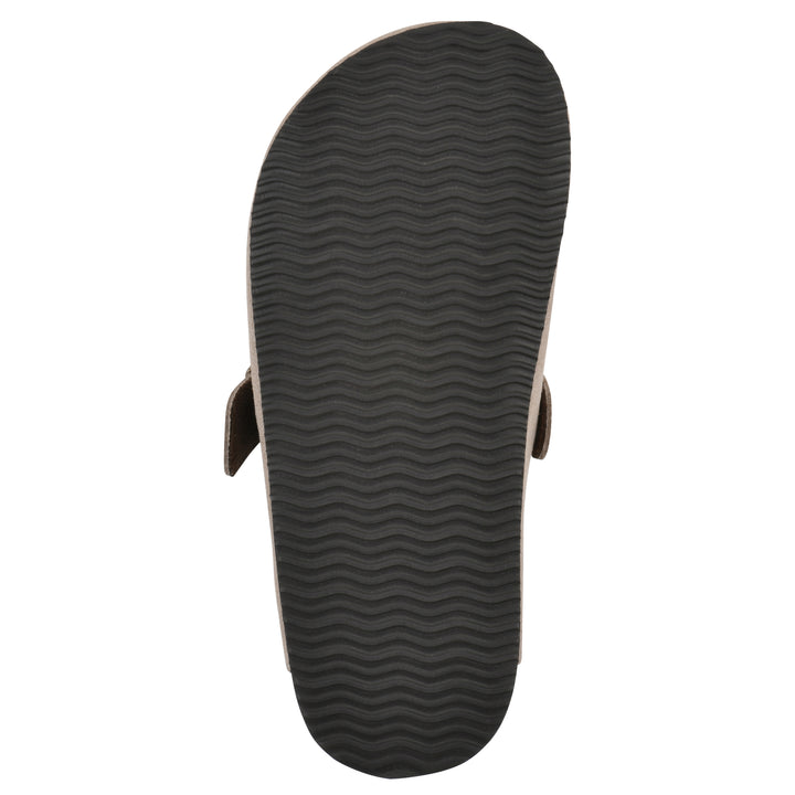 Sole view of a taupe suede children's clog with metal buckle on an adjustable strap, and a brown sole with black bottom