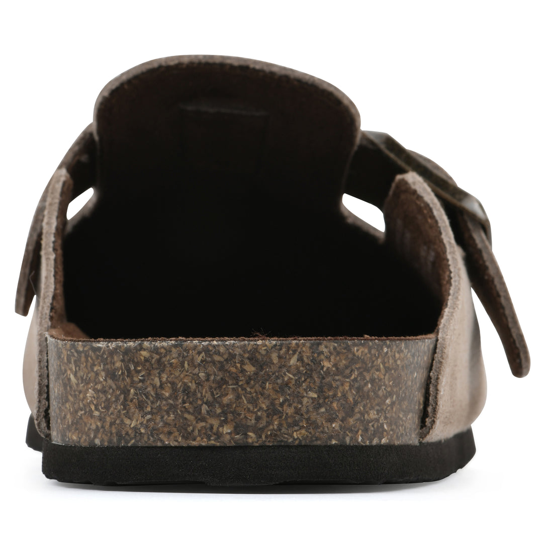 Rear view of a taupe suede children's clog with metal buckle on an adjustable strap, and a brown sole with black bottom