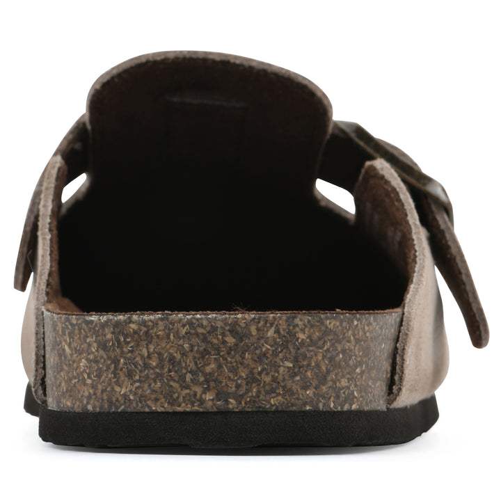 Rear view of a taupe suede children's clog with metal buckle on an adjustable strap, and a brown sole with black bottom