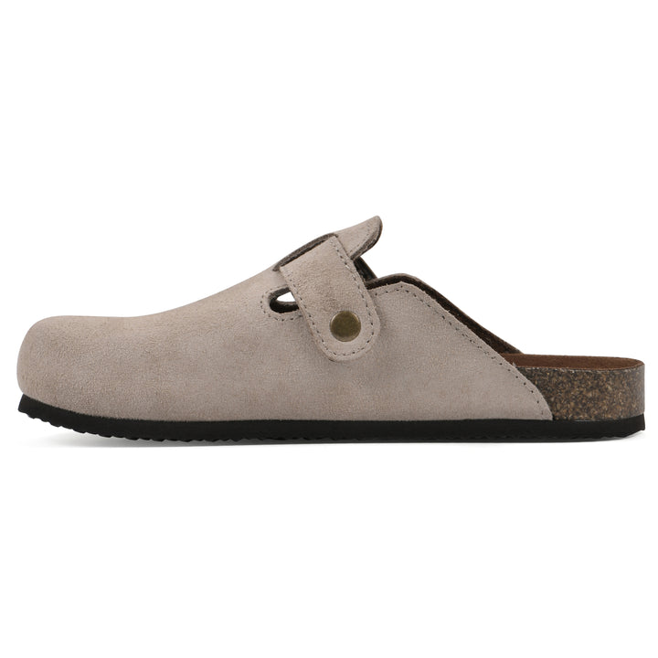 Side view of a taupe suede children's clog with metal buckle on an adjustable strap, and a brown sole with black bottom